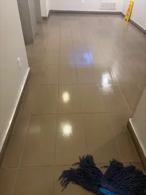 Freshly mopped tile corridor in a condominium common area